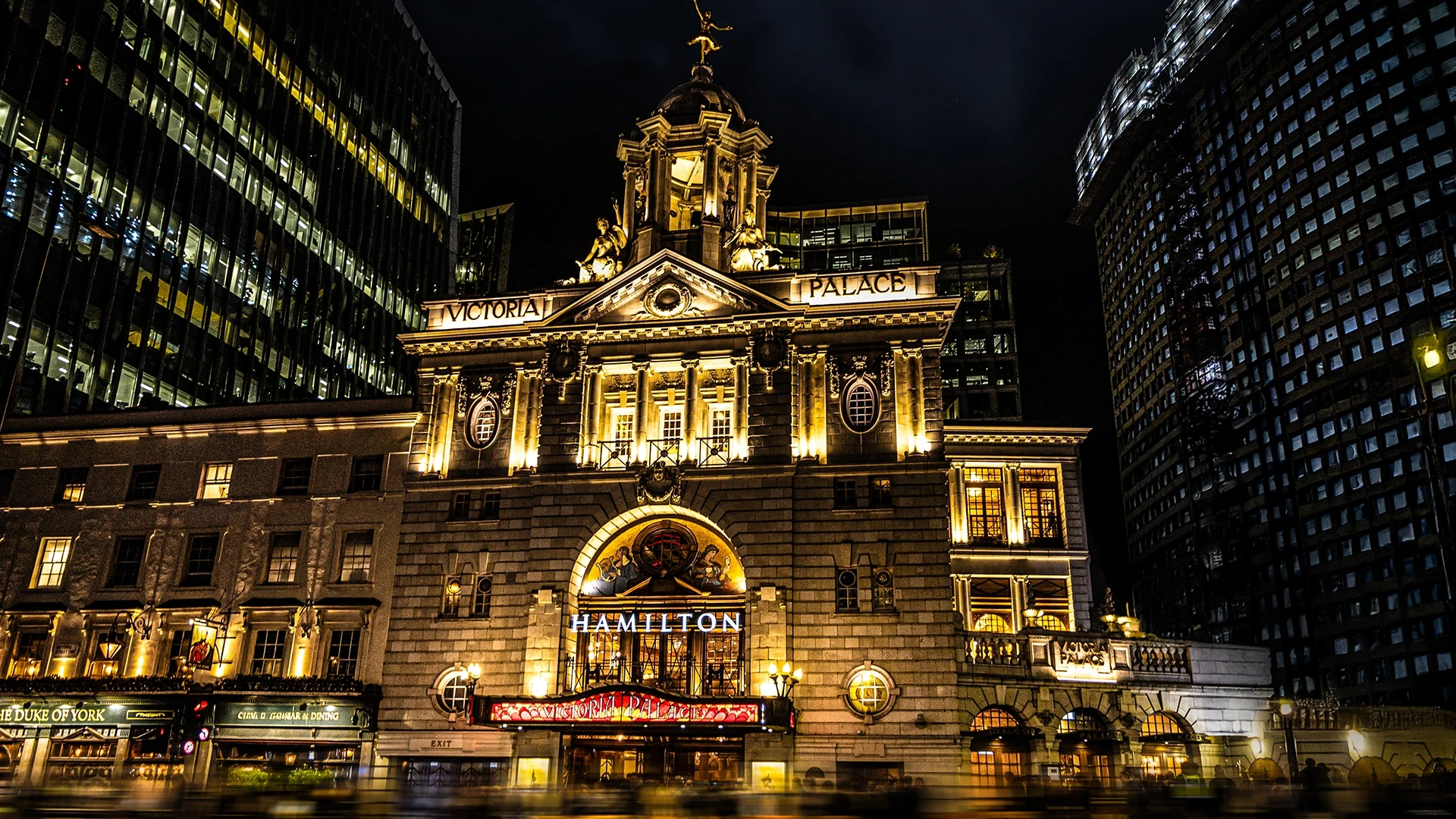 External view of Victoria Palace Theatre with Hamilton signage