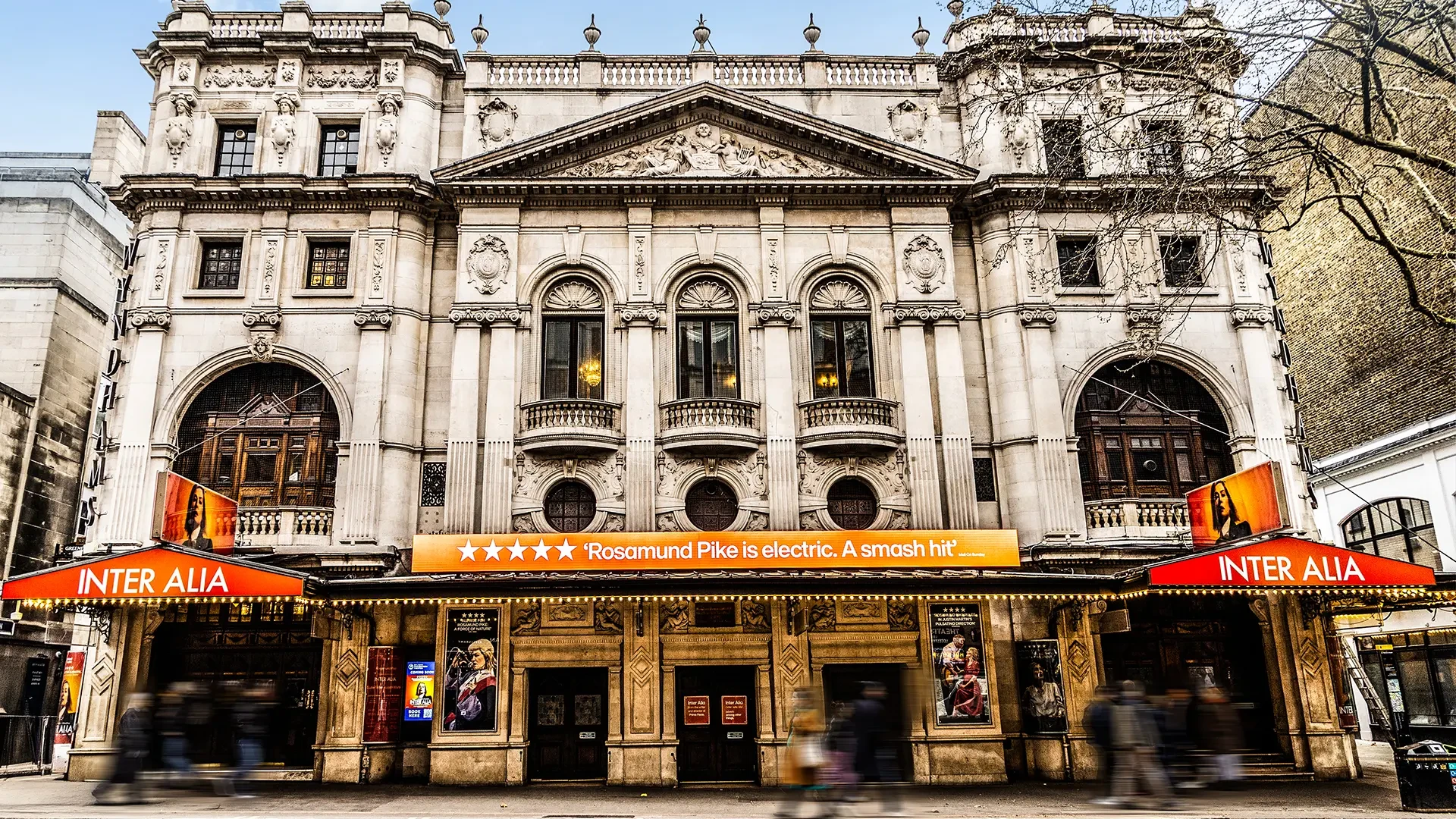 External view of Wyndham's Theatre with Inter alia signage